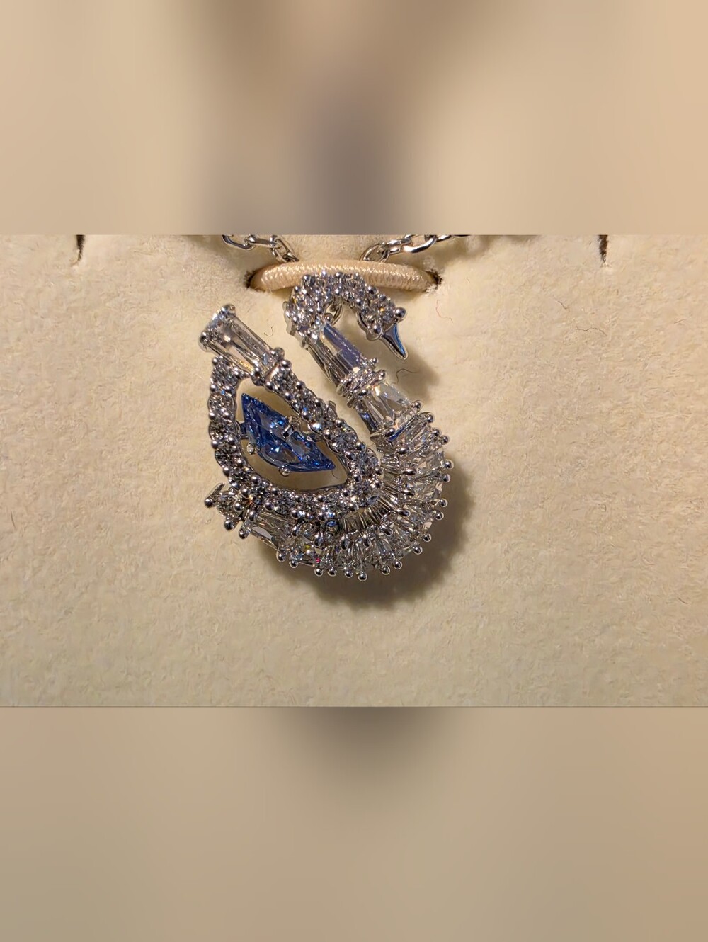 Swarovski’s iconic swan. Suspended from a rhodium plated chain